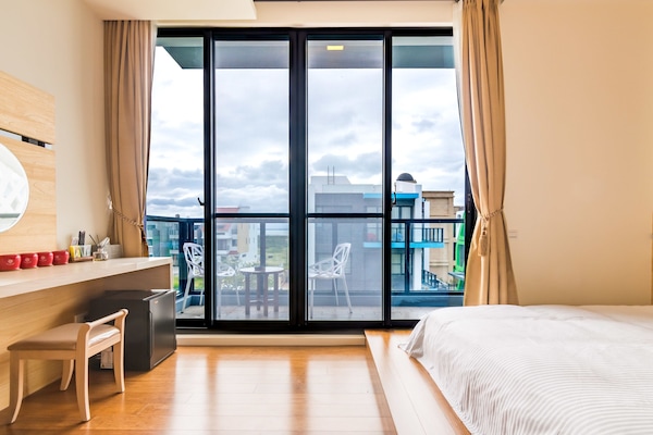 Deluxe vierpersoonskamer, veranda, uitzicht op tuin | Uitzicht vanuit de kamer