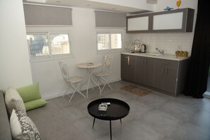 Apartment, Balcony, City View | Private kitchenette | Fridge, microwave, electric kettle - Rooftop Apartment Overlooking Rothschild (Tel Aviv)