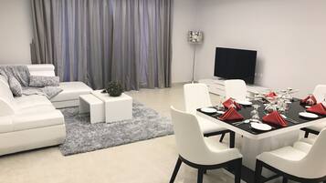 32-inch flat-screen TV with satellite channels, TV