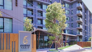 A modern building with multiple balconies and a sign reading "6th Avenue Surin". - 6 Avenue Surin by Lofty (Choeng Thale)