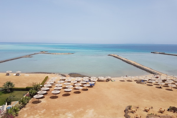 Private beach, beach umbrellas, beach bar