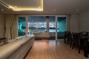 Panoramic Apartment, 3 Bedrooms, Ocean View | Living area | Smart TV