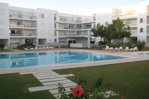Ou apartment is shown on the left side of the picture with lights on.