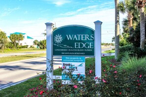 Welcome to Waters Edge Condominium, a waterfront property with lush surroundings and a tropical atmosphere.