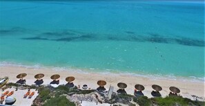 On the beach, sun-loungers, beach towels - Luxurious 4-12 Bedroom Sandy Beachfront  Villa ,24/7 Dedicated Concierge,peloton (Providenciales)