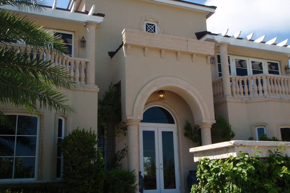 This elegant home has been constructed to the highest standards and is located within minutes of downtown Key West (via automobile or bike path) Yet very private and away from the tourist. Private heated pool. Decorated with exquisite comfortable furnishings incredible paintings and sculptures from renowned artists. This is one of the most impressive homes in Key West due to the benefit of location on the largest lagoon in Key West. Look out upon the clear, deep waters behind the docks, swim in the tranquil coral floored waters. Private Jacuzzi bath in master suite. Well equipped kitchen as if you were home. State of the art television and sound system. Host an intimate retreat with family and friends. <br>CDC sanitation guidelines are in effect to ensure that your family is safe from the spread of COVID-19. Also, the home is vacant for a minimum of 7 days prior to your arrival, this will ensure a thorough sanitation has been down to the home.<br> Lifetime memories/Private pool/WiFi/Dog OK/Self check-in-out/High Cleanliness!