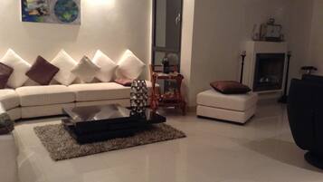 Deluxe Apartment, Non Smoking | Living area | TV