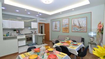 A modern kitchen with a dining area.