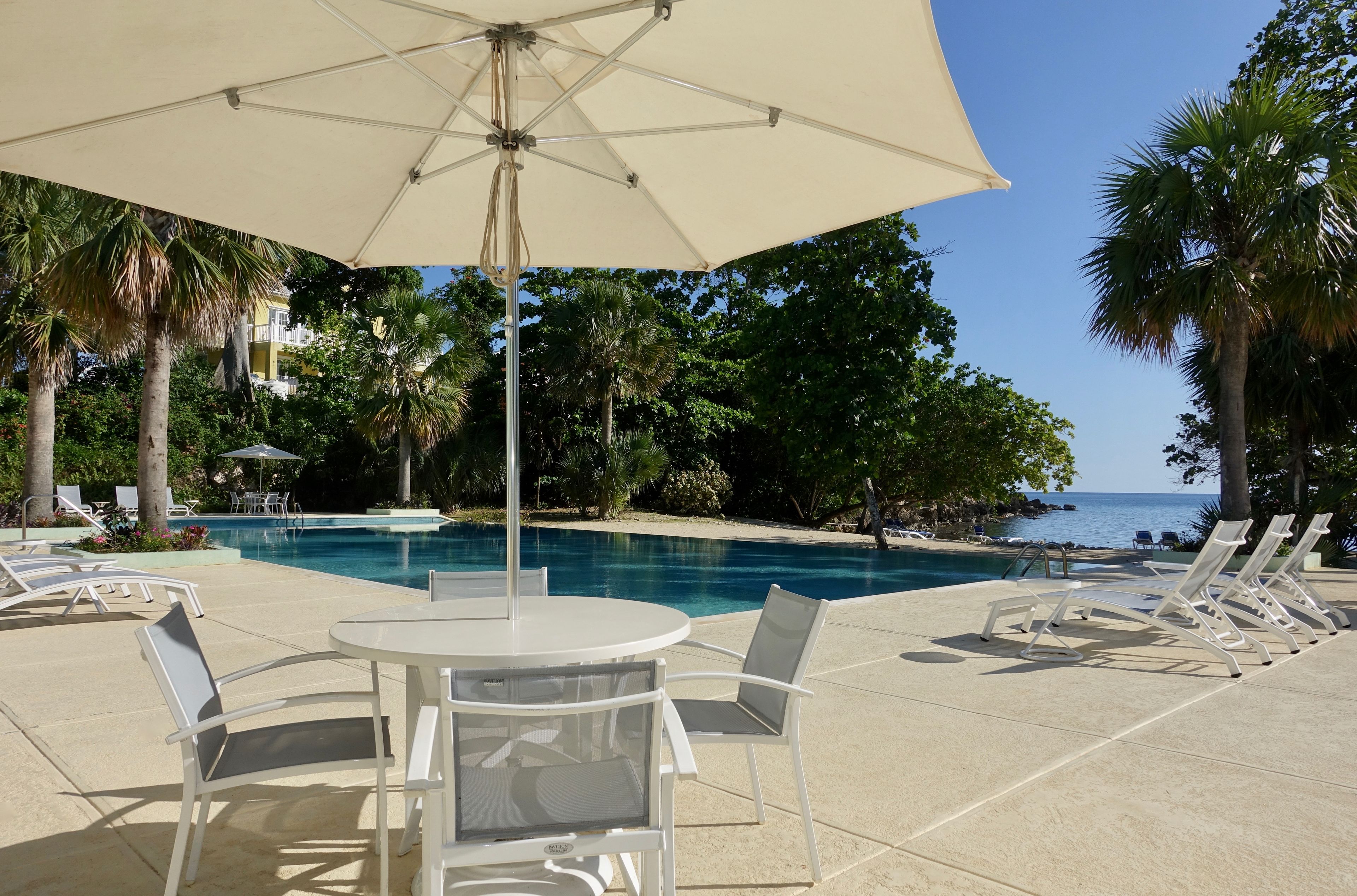 Outdoor pool, pool umbrellas, sun loungers
