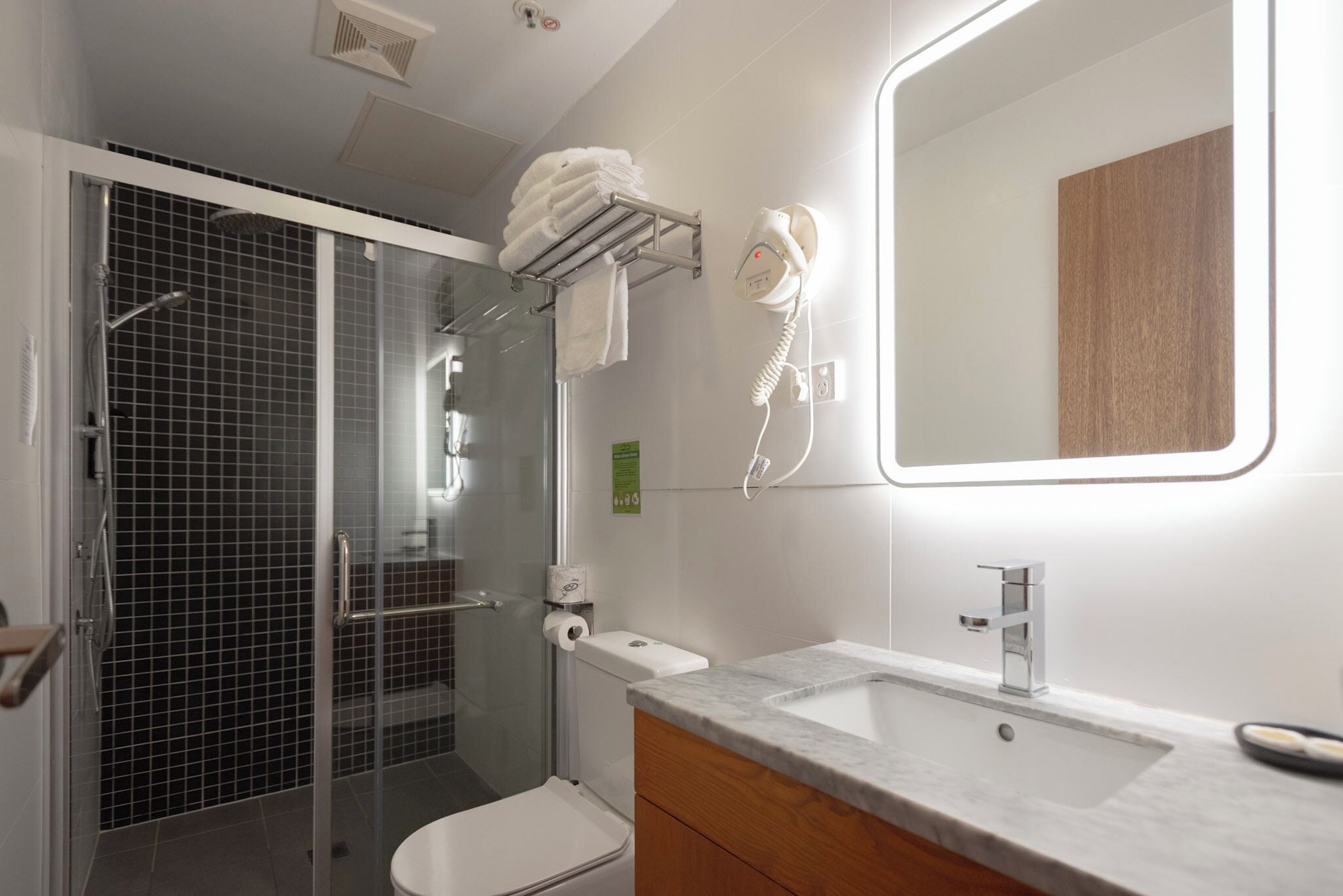 signature suite, multiple beds | bathroom | shower, rainfall showerhead, free toiletries, hair dryer