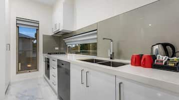 Two Bedroom Apartment | Private kitchen | Fridge, microwave, coffee/tea maker, electric kettle