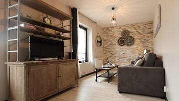 Flat-screen TV, DVD player, books, video library