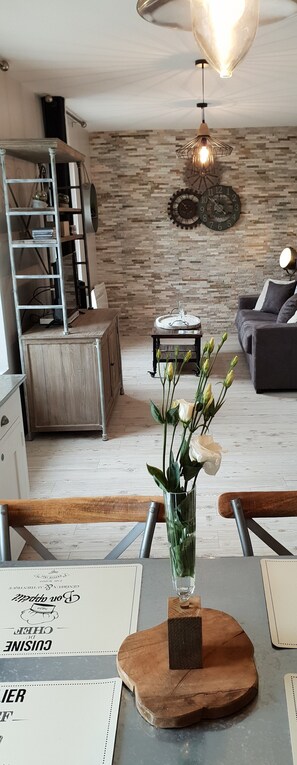 Flat-screen TV, DVD player, books, video library