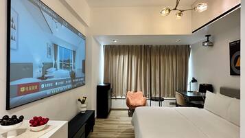 Animation Home Theater Room | In-room safe, desk, laptop workspace, blackout drapes