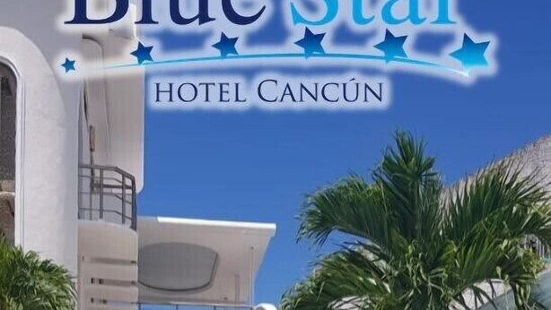A pool area with lounge chairs, a water feature, and a modern building with balconies. - Hotel Blue Star Cancun (Cancun)
