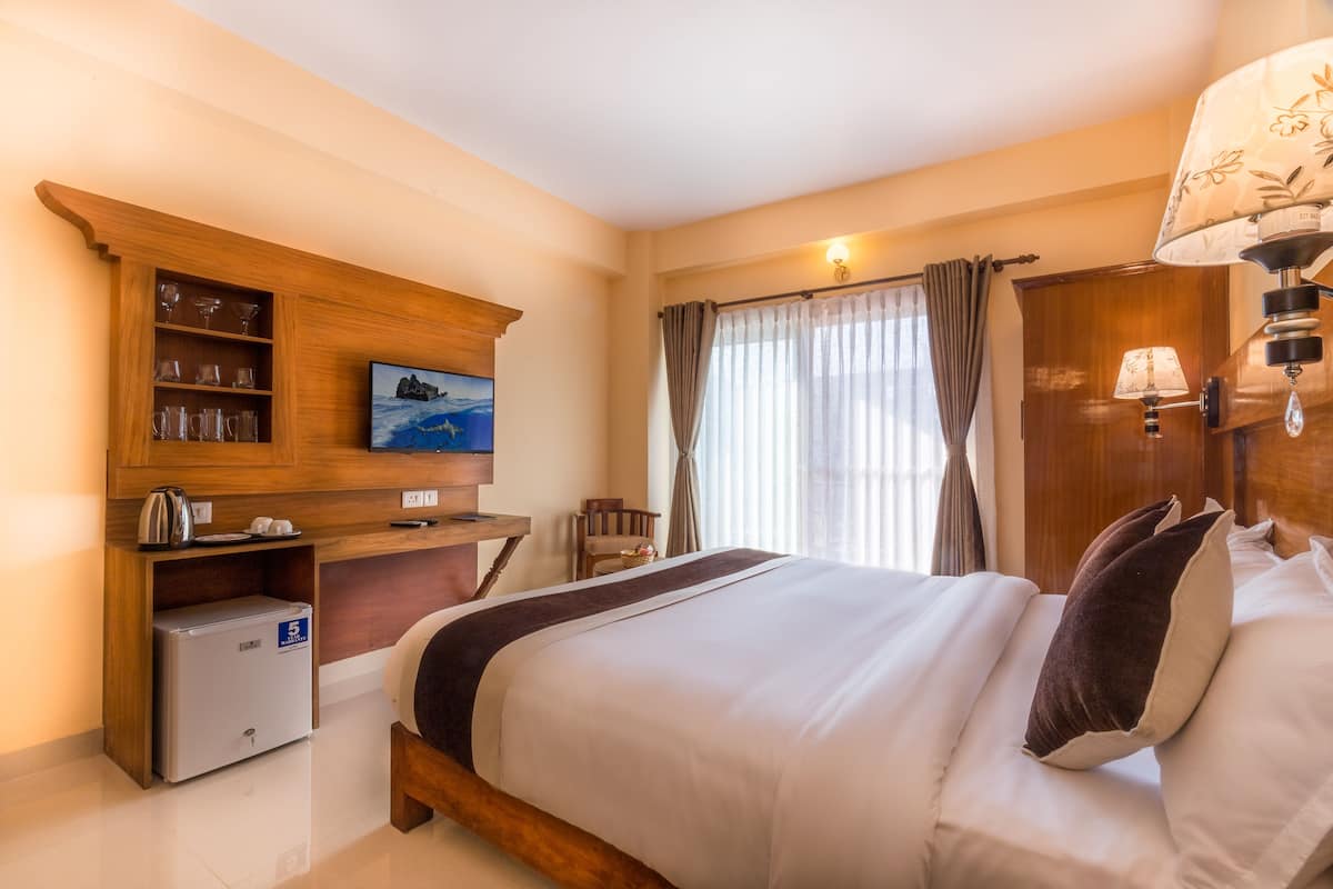Premium bedding, down duvets, laptop workspace, blackout curtains
