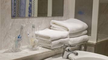 Bidet, towels, soap, toilet paper