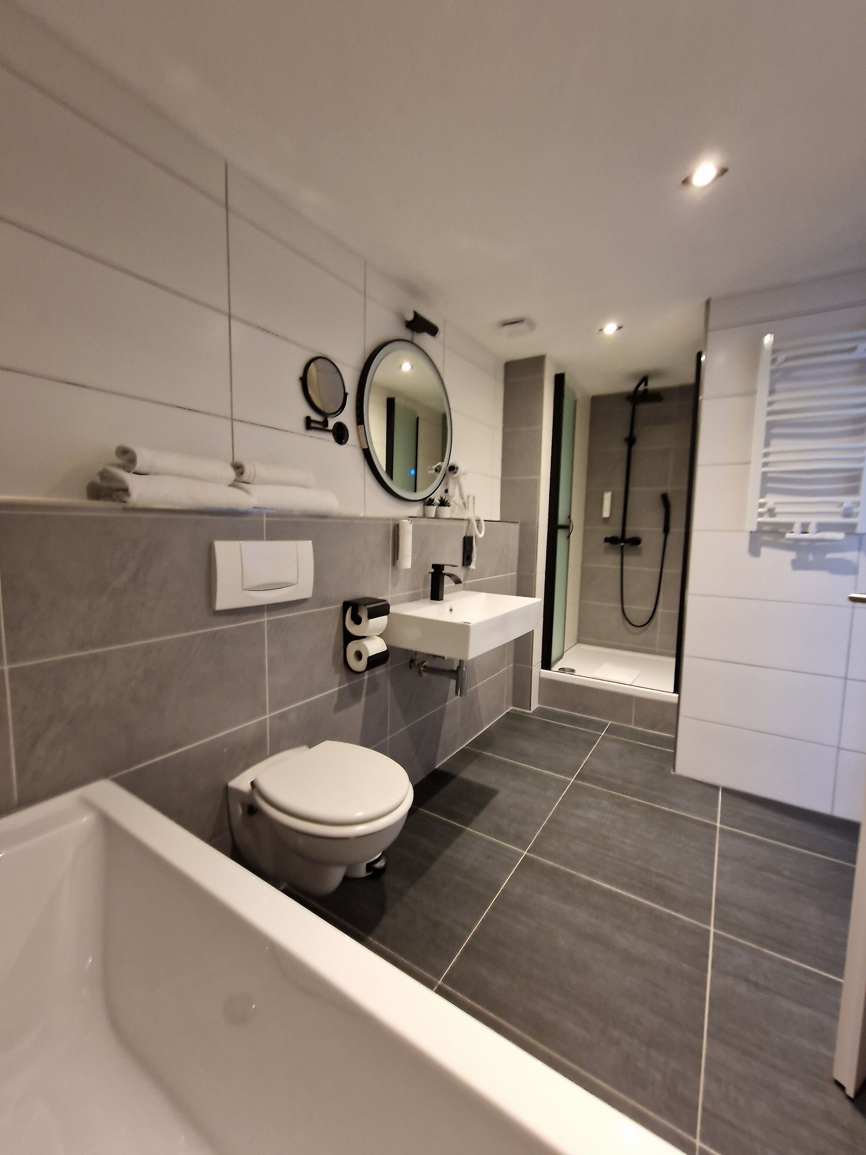 deluxe double room | bathroom | shower, hair dryer, towels, soap