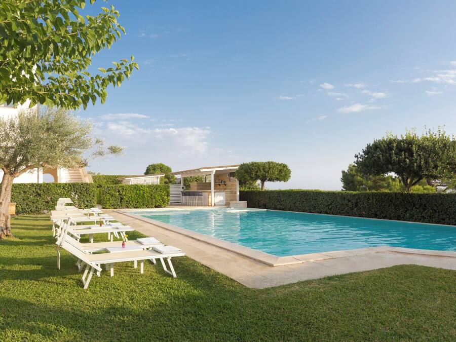 Seasonal outdoor pool, pool loungers