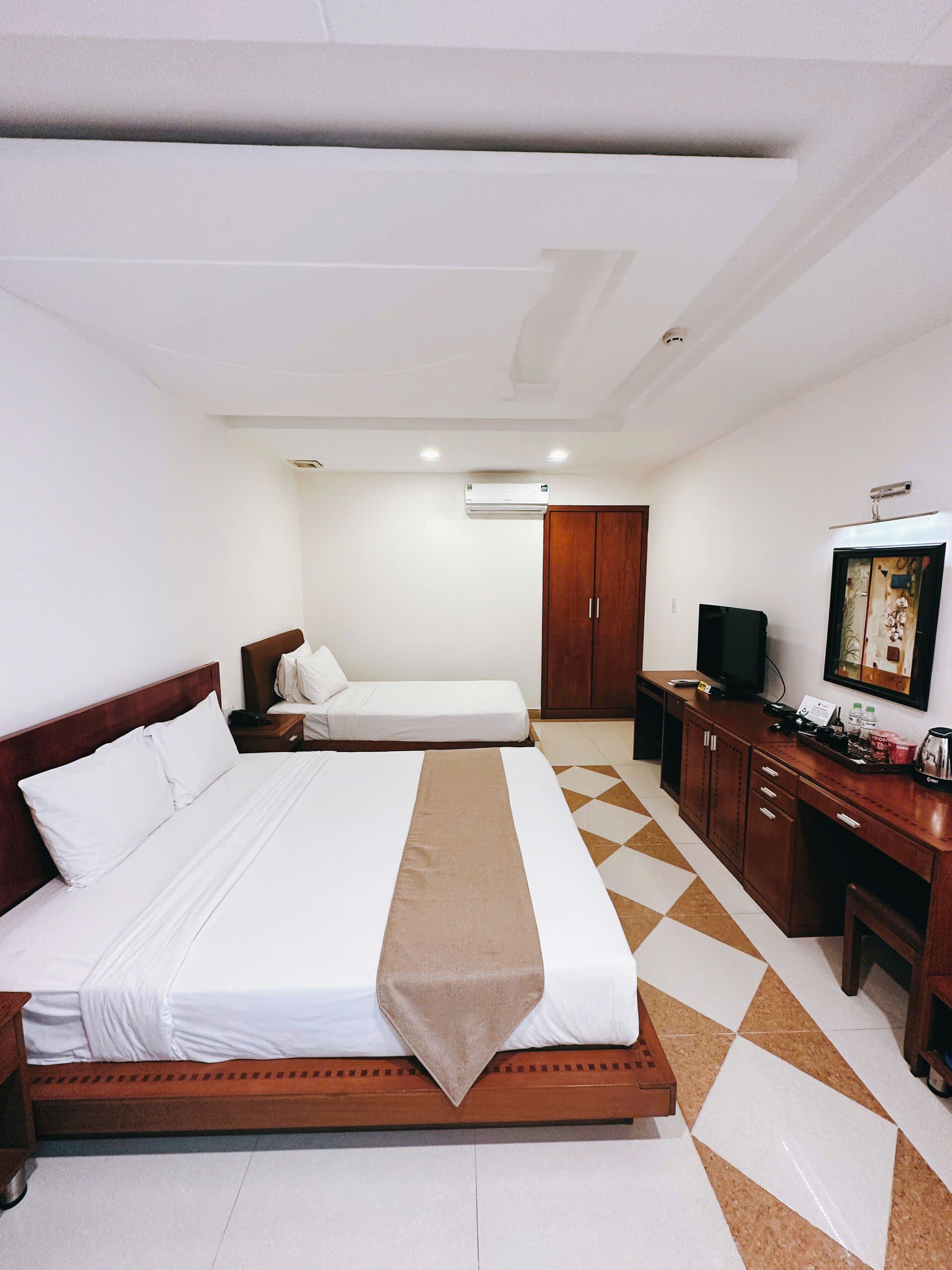 FamilieTwin kamer | Een minibar, een kluis op de kamer, verduisterende gordijnen