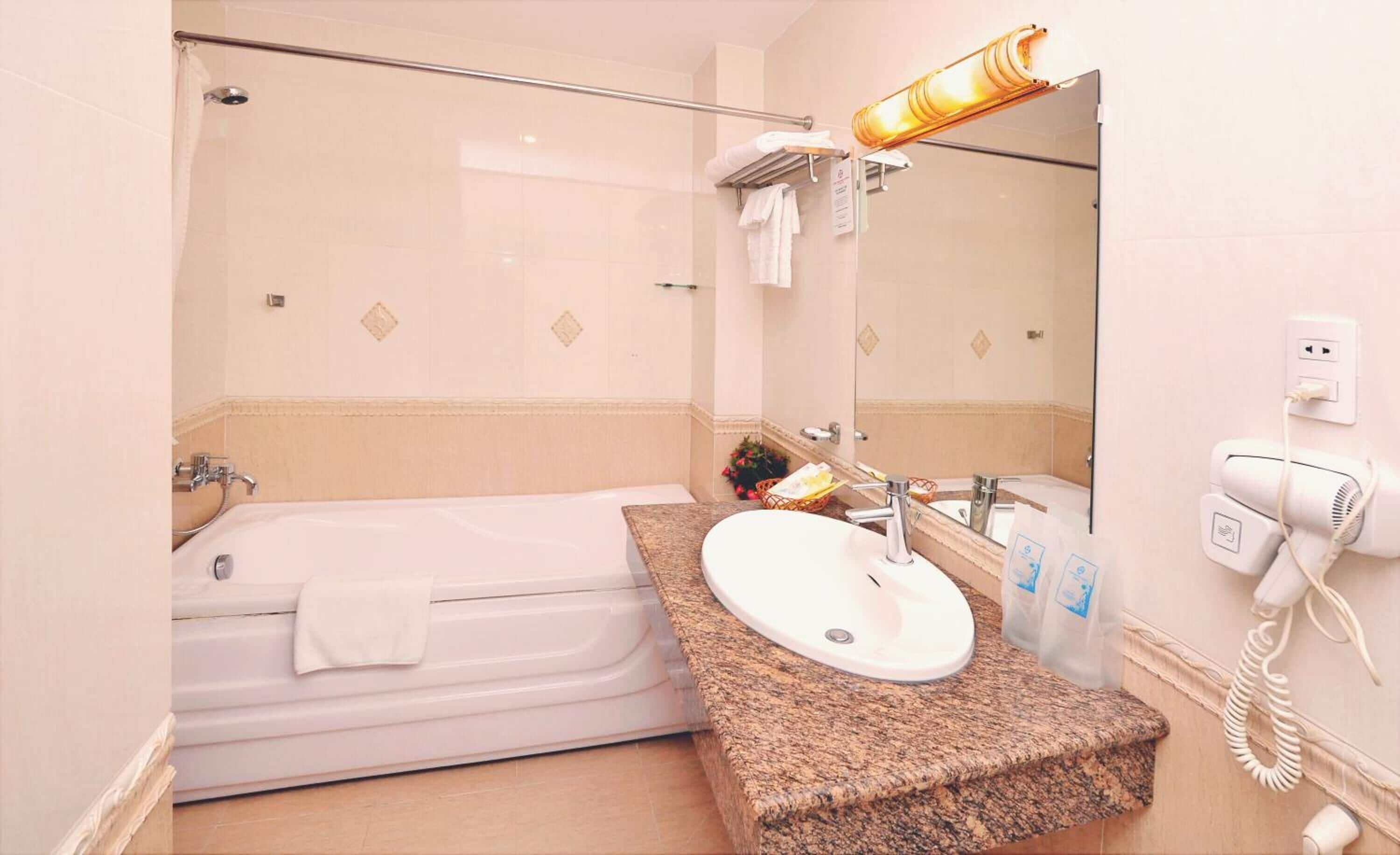 combined shower/bathtub, free toiletries, hair dryer, slippers