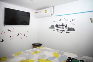 Habitación doble Deluxe, 1 cama Queen size | Caja de seguridad en la habitación, cortinas blackout y insonorización 