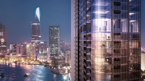A modern high-rise building with a glass facade and balconies, set against a city skyline at night. - Jack Hai Vinhome Apartment (Ho Chi Minh City)