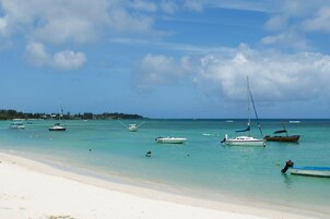 On the beach, white sand, beach towels