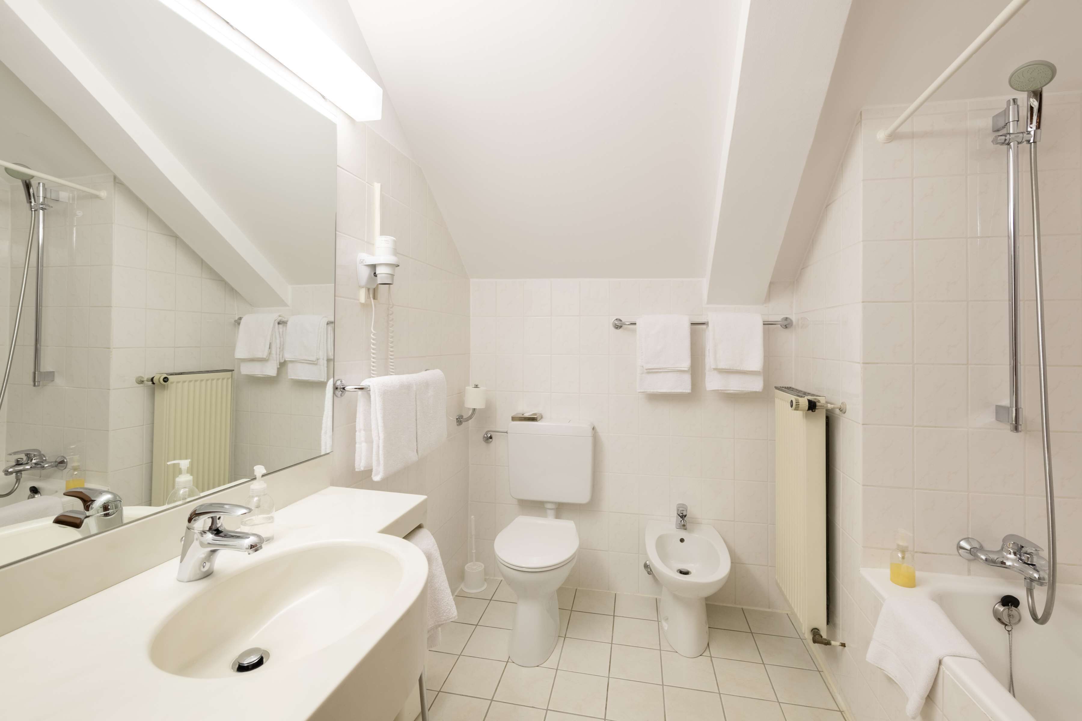 suite, multiple beds, city view | bathroom | hair dryer, towels