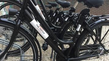 A row of bicycles with a white label that reads "THE MATCH".