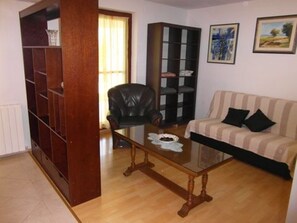 Apartment, 1 Bedroom | Living area | Flat-screen TV