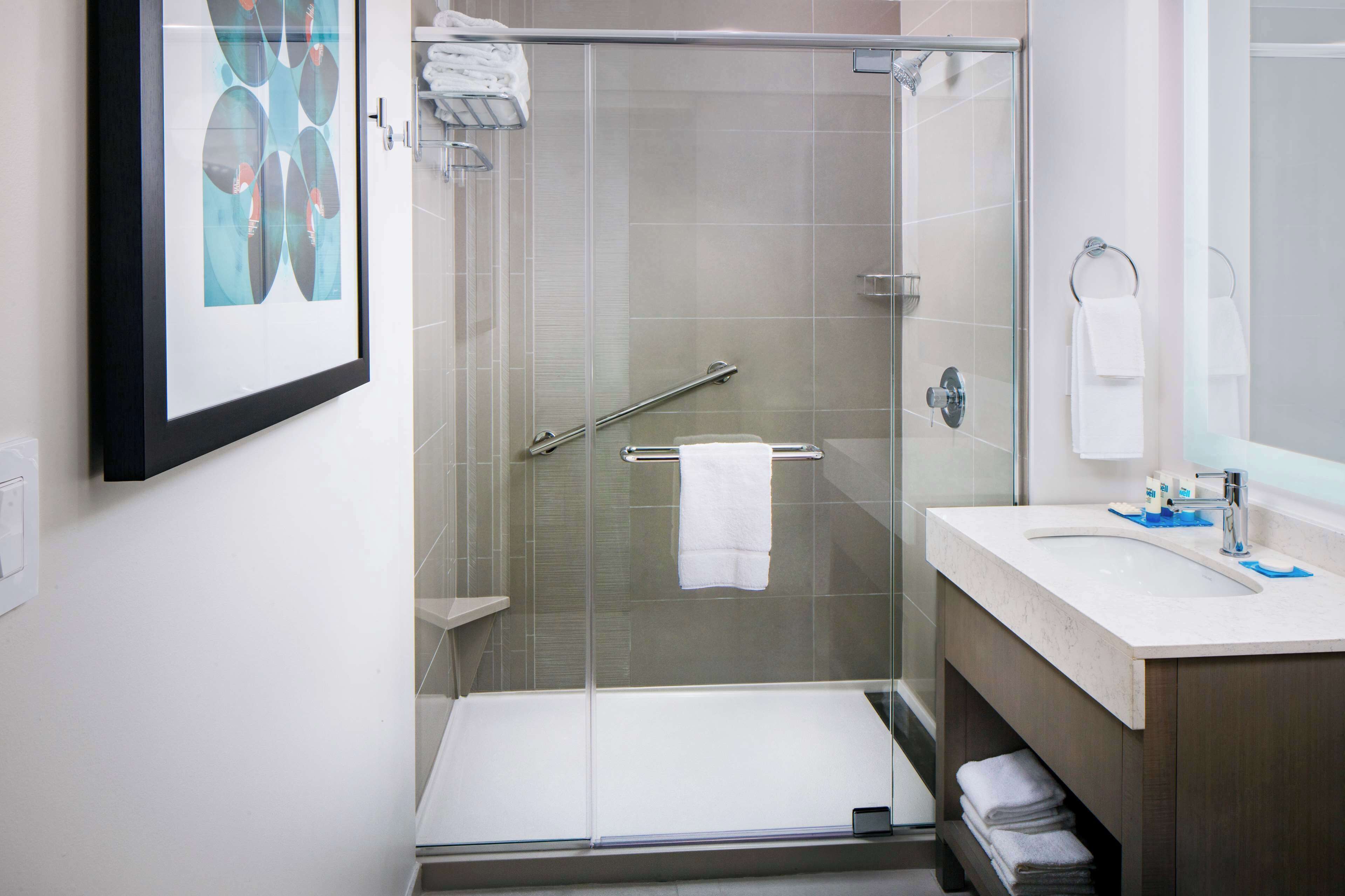 eco-friendly toiletries, hair dryer, towels