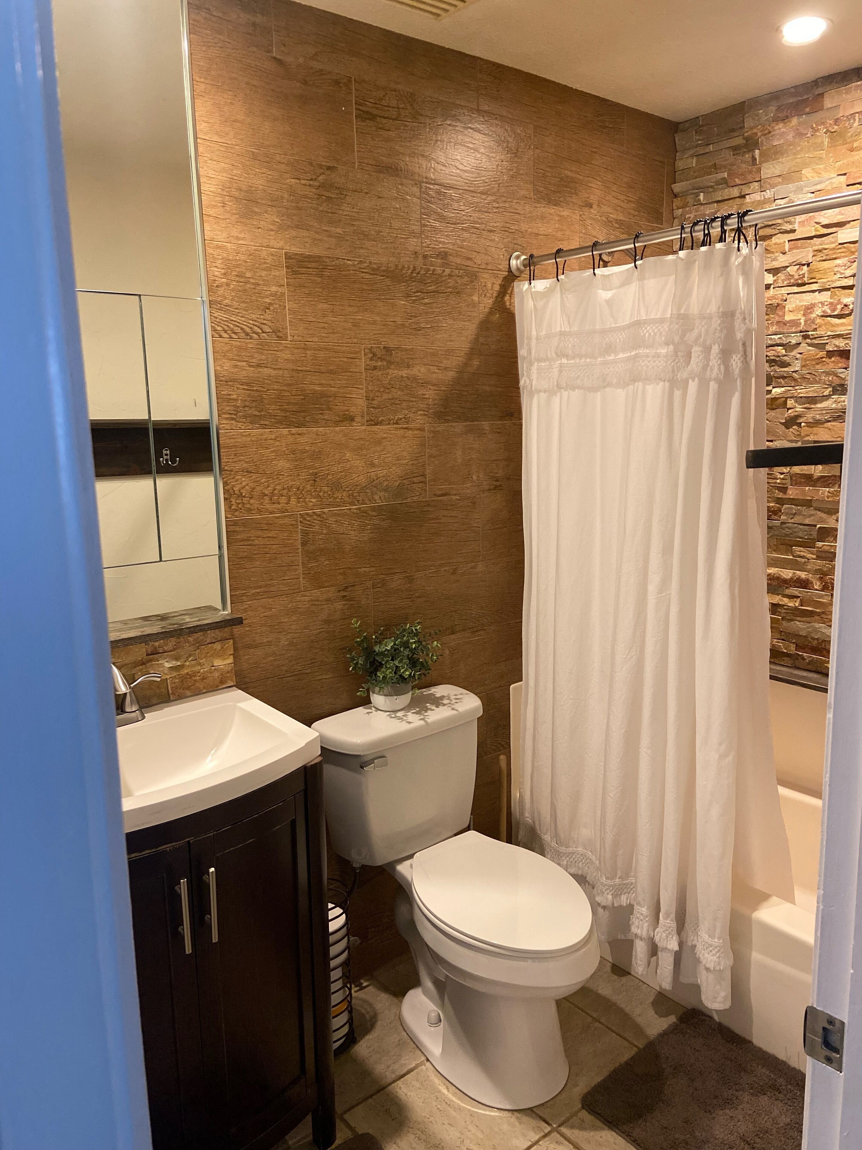 Guest bathroom with shower and bathtub