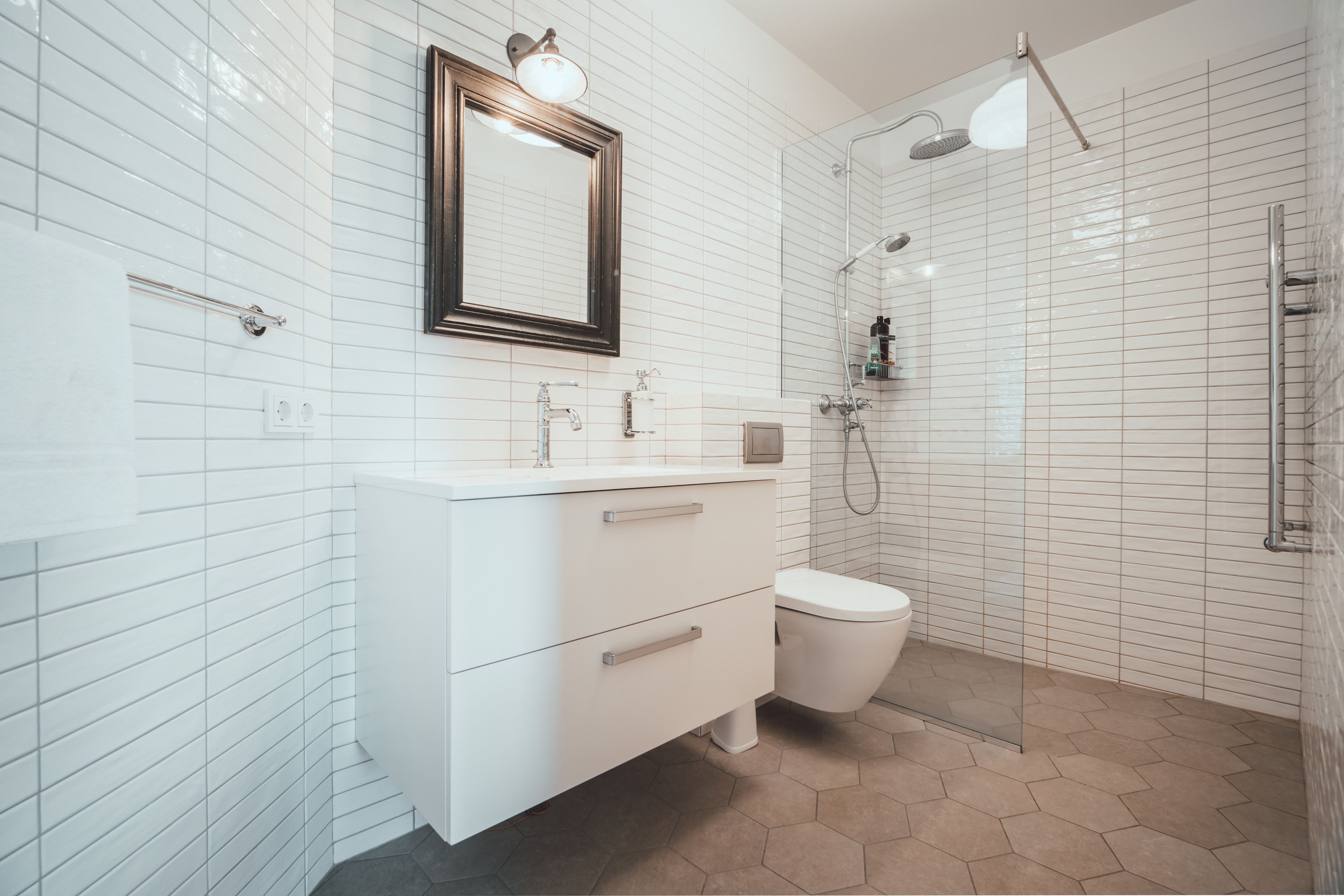 Shower, rainfall showerhead, hair dryer, towels