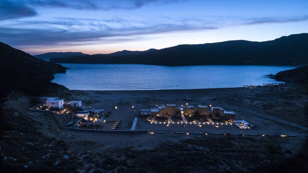 A coastal resort with multiple buildings and a beach area.