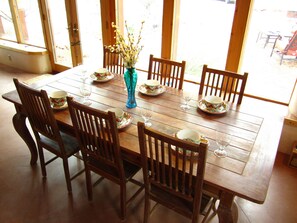 Enjoy casual dining for six in this spacious dining area with a beautifully set table.