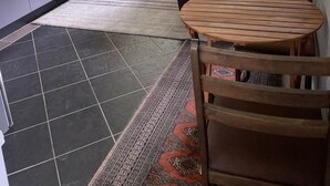 A compact room with a bed, a sofa, a dining table, and a kitchenette. - Studio at 60.
Private apartment, close to beaches and cafes. Breakfast included. (Valla Beach)