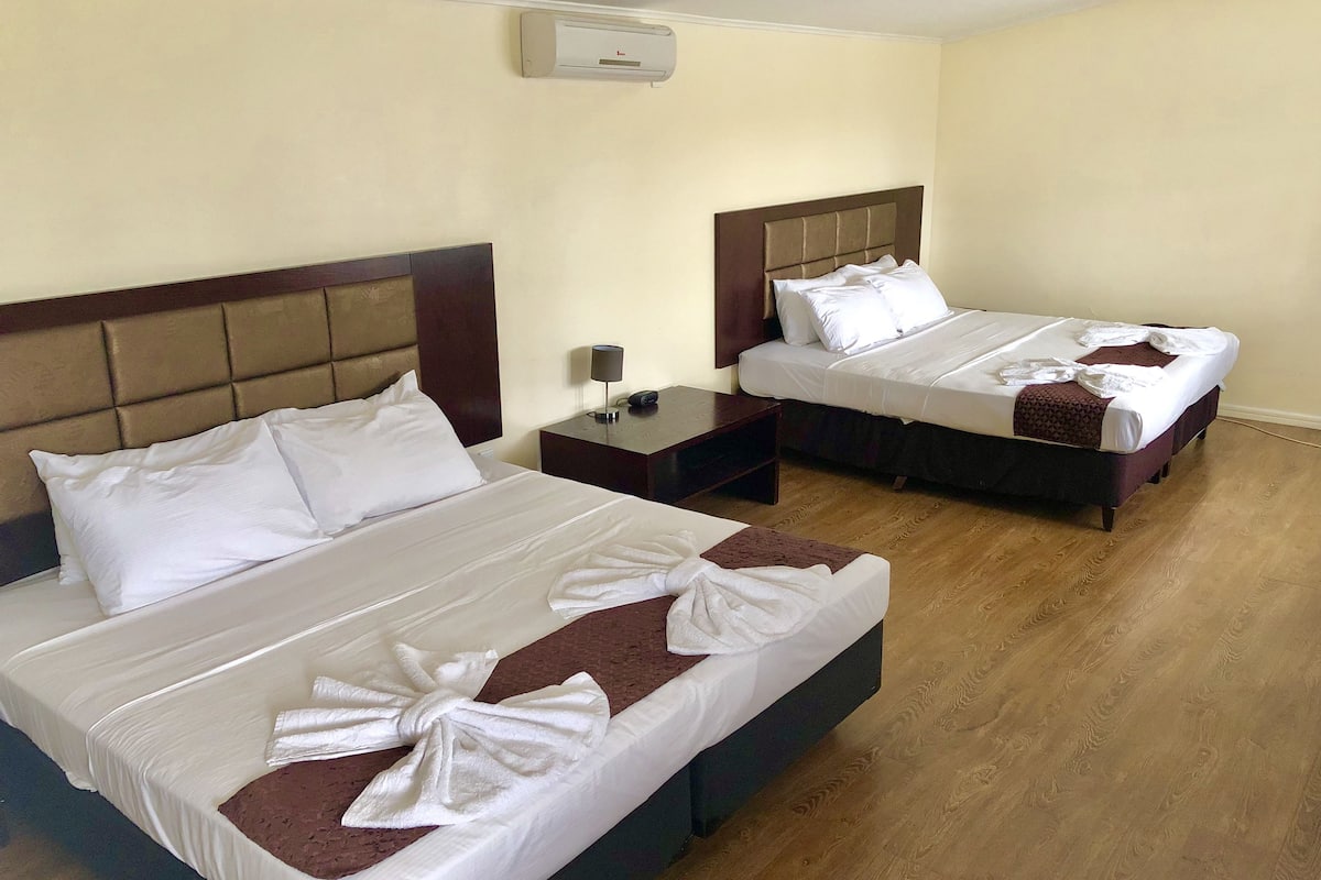 Standard Quadruple Room, Multiple Beds | Blackout drapes, bed sheets