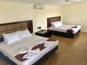 Standard Quadruple Room, Multiple Beds | Blackout drapes, bed sheets - The White House Hotel Samoa (Apia)