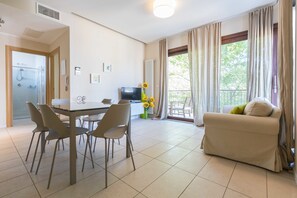 Apartment, 3 Bedrooms, 2 Bathrooms | Living area | Flat-screen TV - Tasso Apartments (Comacchio)