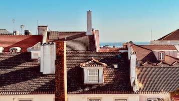 A residential area with multiple buildings featuring red-tiled roofs and brick facades.