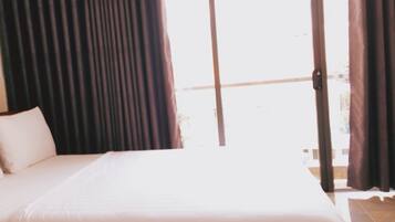 VIP Balcony Room | Minibar, blackout drapes, WiFi (free), bed sheets
