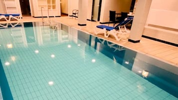 Indoor pool, open 6:30 AM to 10:00 PM, pool loungers