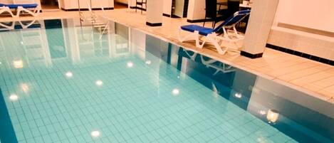 Indoor pool, open 6:30 AM to 10:00 PM, pool loungers
