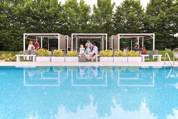 Seasonal outdoor pool, open 10:00 AM to 8:00 PM, pool umbrellas