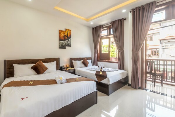 Chambre Deluxe | Minibar, bureau, accès au Wi-Fi (inclus), literie fournie