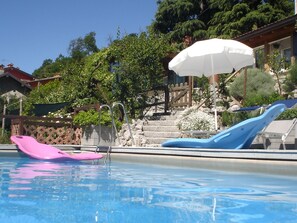 Outdoor pool, pool umbrellas, pool loungers