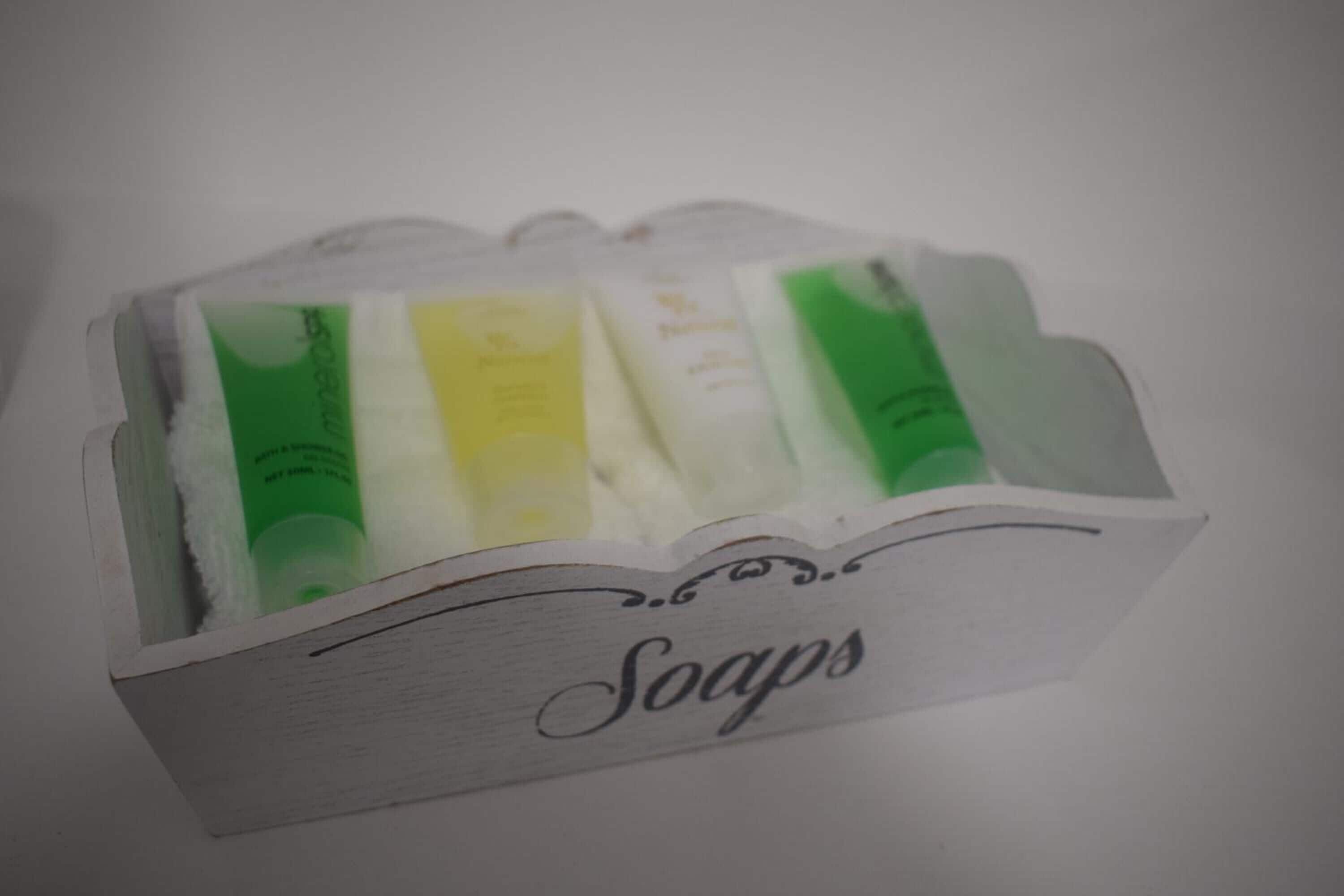 A wooden soap box with the word "Soaps" on it.
