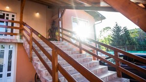 A wooden staircase leading to a building with a sign that reads "Restaurant." - B&B Mreznica House DP (Duga Resa)
