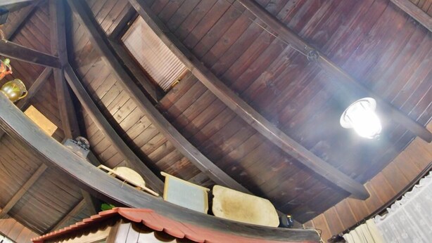 A wooden ceiling with a clock and a light fixture. - B&B Mreznica House DP (Duga Resa)
